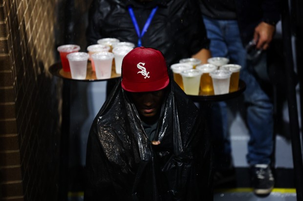 People make their way to the concourse during a rain delay while the Chicago White Sox play the Toronto Blue Jays during the seventh inning at Rate Field Tuesday July 8, 2025, in Chicago. (Armando L. Sanchez/Chicago Tribune)