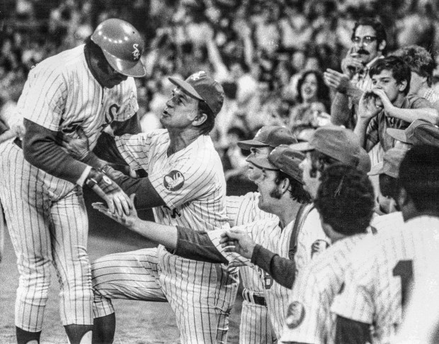 Dick Allen is greeted by White Sox manager Chuck Tanner after hitting a home run on June 4, 1974, at Comiskey Park. (Ray Gora/Chicago Tribune)