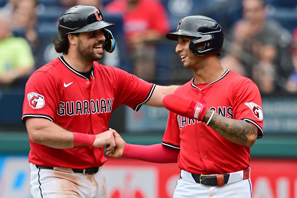 Jul 20, 2025; Cleveland, Ohio, USA; Cleveland Guardians shortstop Brayan Rocchio, right, celebrates with Cleveland Guardians catcher Austin Hedges, left, after scoring on a hit by designated hitter David Fry (not pictured) during the fourth inning against the Athletics at Progressive Field. Mandatory Credit: Ken Blaze-Imagn Images