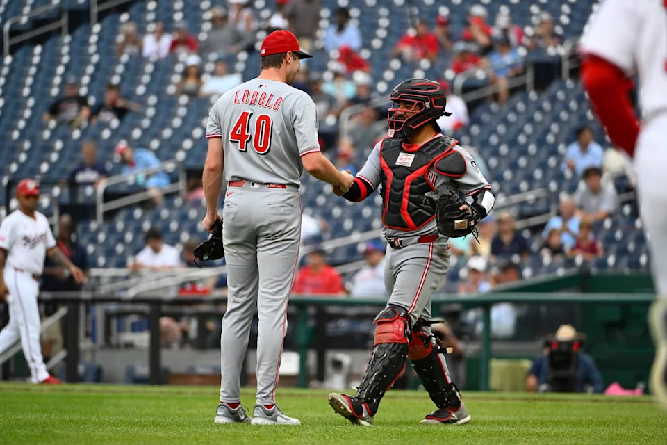 Reds starting pitcher Nick Lodolo is congratulated by catcher Jose Trevino after throwing a complete game shutout against the Washington Nationals at Nationals Park July 23. Lodolo allowed four hits, walked none and struck out eight.