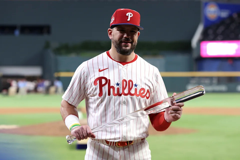 National League designated hitter Kyle Schwarber of the Philadelphia Phillies celebrates with the MLB All-Star Game MVP trophy