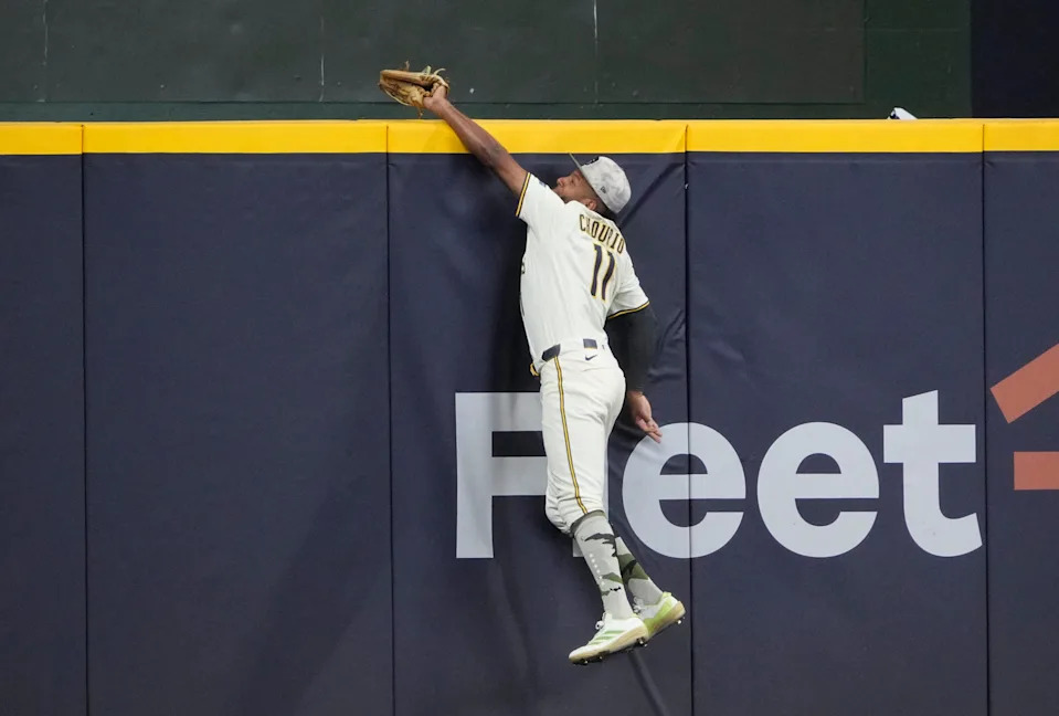 May 18, 2025; Milwaukee, Wisconsin, USA; Milwaukee Brewers outfielder Jackson Chourio (11) keeps a home run from going over the wall against the Minnesota Twins in the eighth inning at American Family Field. Mandatory Credit: Michael McLoone-Imagn Images