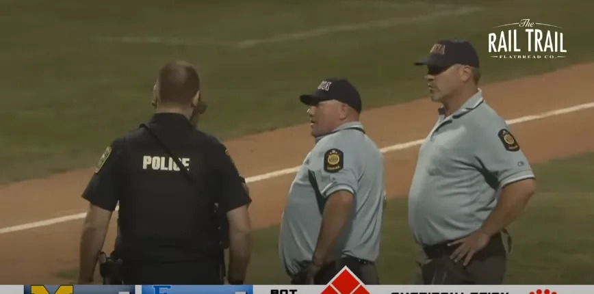 A police officer on the field. @MyMilfordTV/YouTube