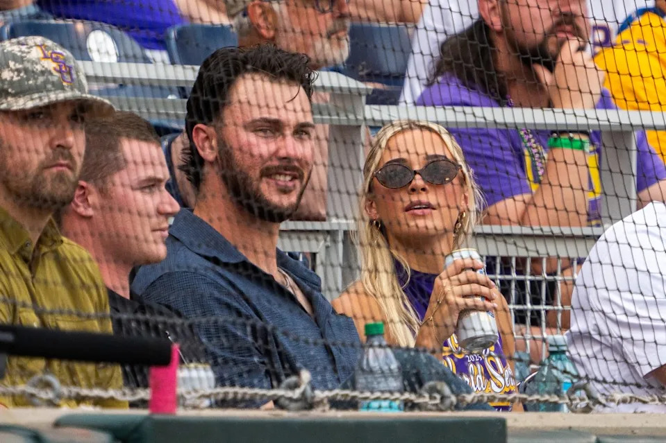 Paul Skenes and Livvy Dunne watch from behind home plate during the first inning between UCLA and LSU at Charles Schwab Field. Dylan Widger-Imagn Images