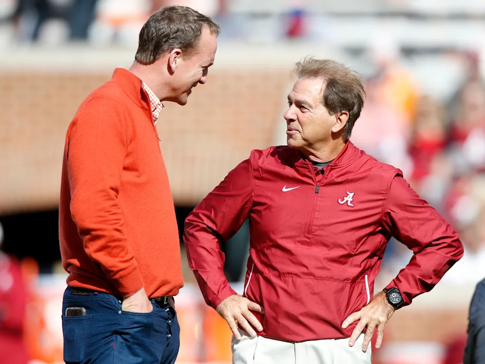 Nick Saban talks with Peyton Manning before an Alabama-Tennessee game in 2018. (Wade Payne/AP Photo)