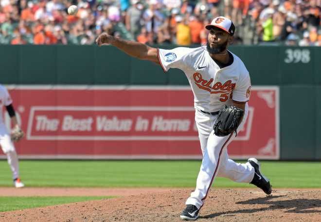 BALTIMORE, MD - JULY 28: Baltimore Orioles pitcher Seranthony Domínguez (56) pitches during the San Diego Padres versus the Baltimore Orioles on July 28, 2024 at Oriole Park at Camden Yards in Baltimore, MD. (Photo by Mark Goldman/Icon Sportswire via Getty Images)