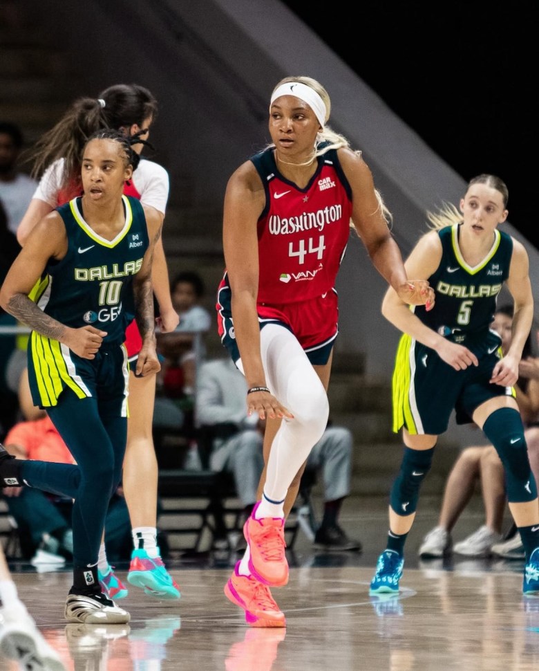 Washington Mystics forward Kiki Iriafen celebrates after a score during the team's 91-88 win against the Dallas Wings on Sunday, June 22. (Jonae Guest/The Washington Informer)