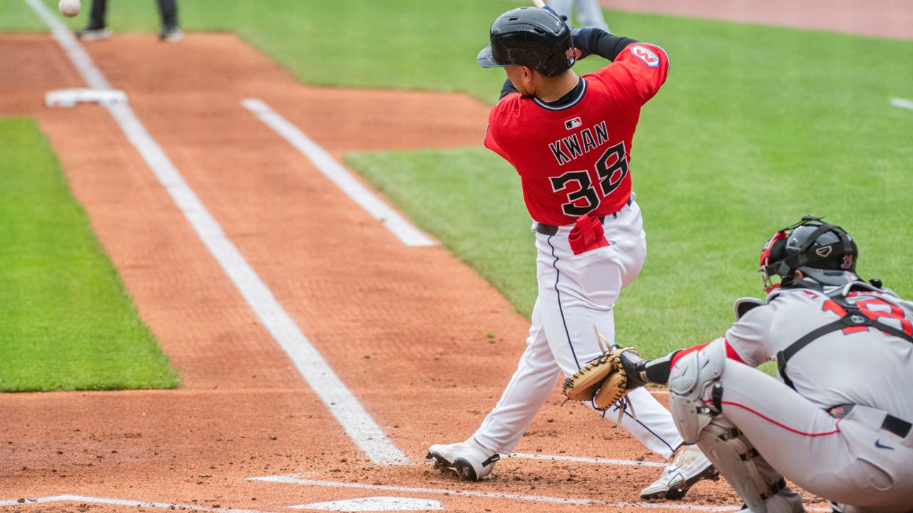 Cleveland Guardians' Steven Kwan (38) hits a double off Boston Red Sox starting pitcher Tanner Houck as catcher Blake Sabol looks on during first inning in the first baseball game of a doubleheader Saturday, April 26, 2025. in Cleveland. (AP Photo/Phil Long)