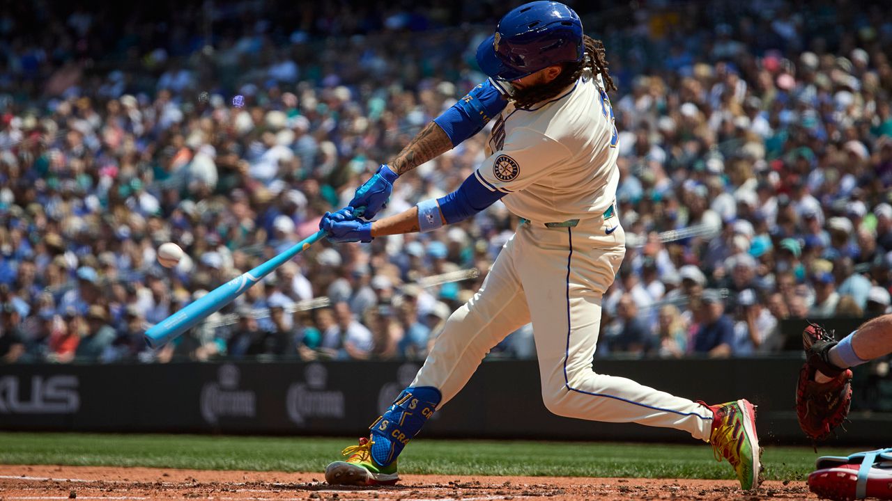 Seattle Mariners' J.P. Crawford hits a grand slam off Cleveland Guardians starting pitcher Luis L. Ortiz during the second inning of a baseball game Sunday, June 15, 2025, in Seattle. (AP Photo/John Froschauer)