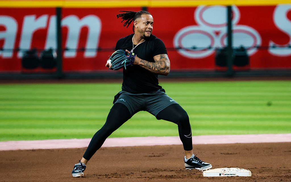 Diamondbacks infielder Ketel Marte prepares to throw ball standing on second base
