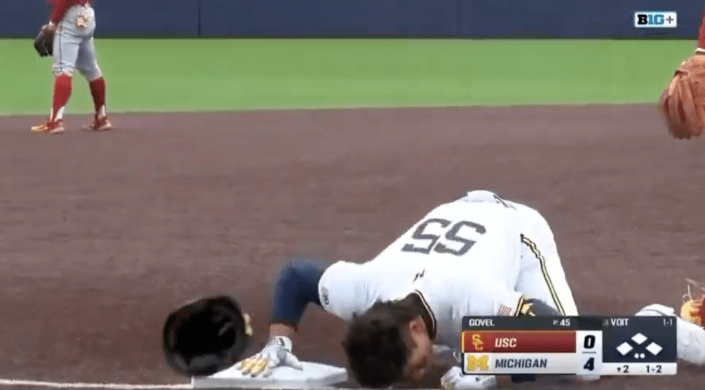 Michigan player Mitchell Volt puts a pretend straw to his nose to mimic cocaine use. 