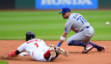 Cleveland Guardians' Angel Martinez slides safely into second base for a double as Los Angeles Dodgers second baseman Miguel Rojas misplays the baseball during the first inning of a baseball game, Wednesday, May 28, 2025, in Cleveland.