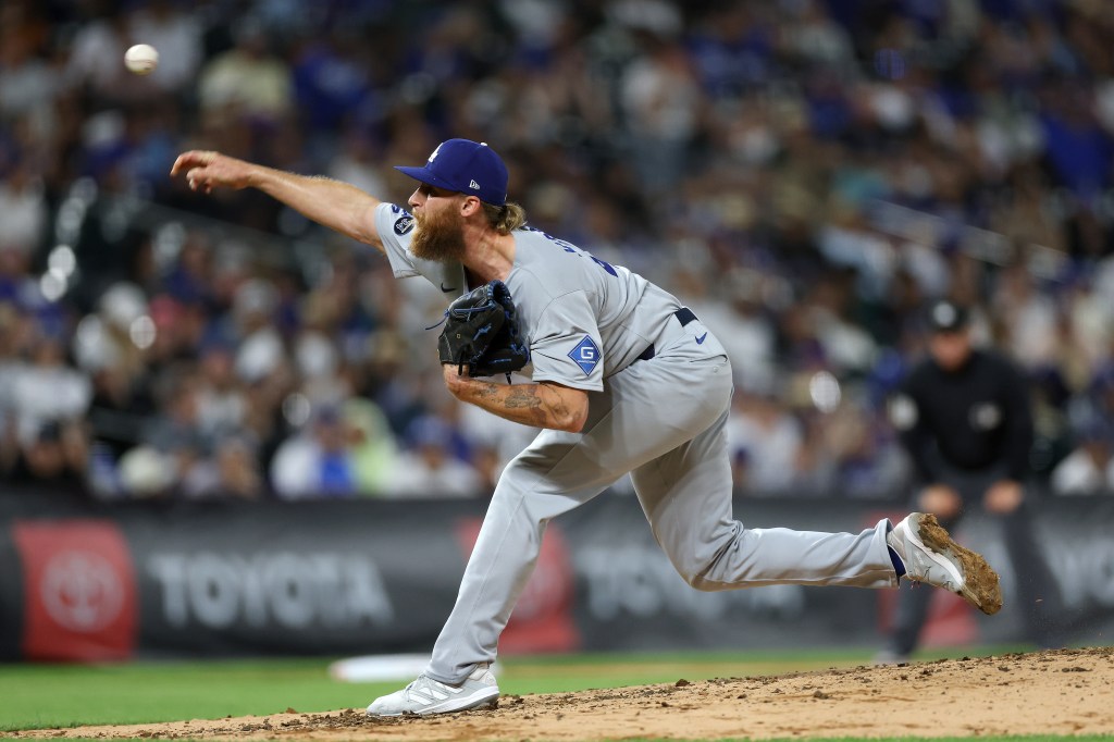Los Angeles Dodgers pitcher throwing a baseball.