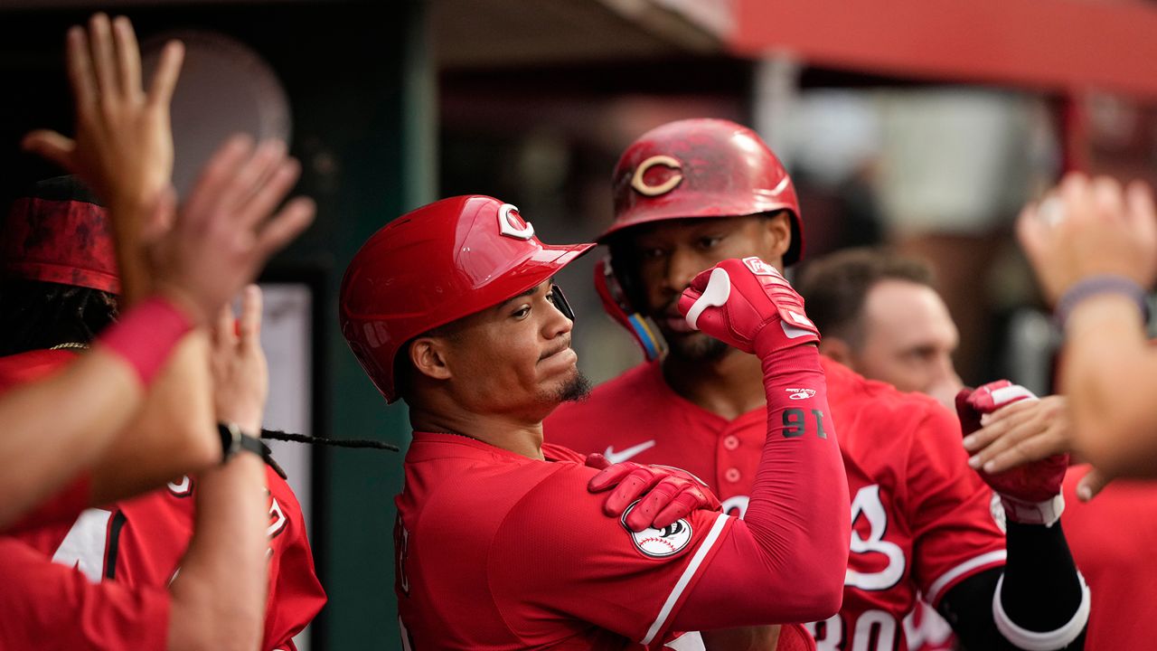 Cincinnati Reds' Noelvi Marte celebrates in the dugout after hitting a two-run homer during the fourth inning of a baseball game against the Miami Marlins in Cincinnati, Wednesday, July 9, 2025. (AP Photo/Carolyn Kaster)