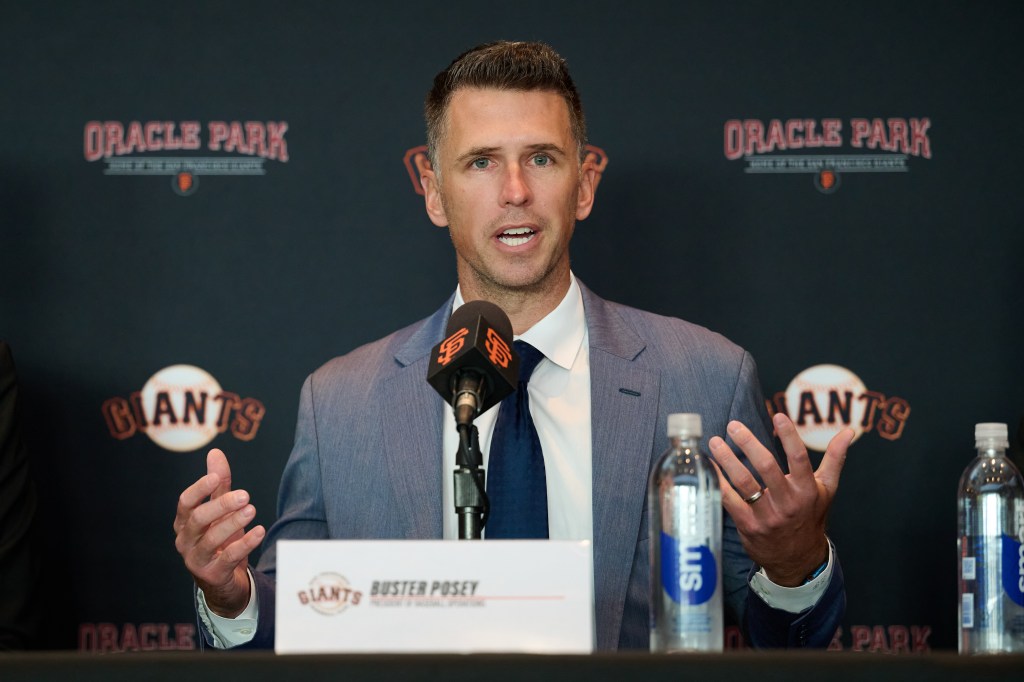 Giants president of baseball operations Buster Posey addresses the media during an introductory press conference