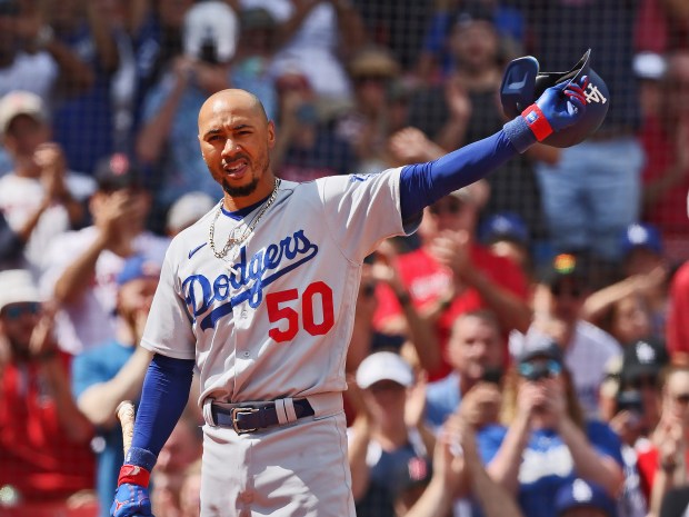 Los Angeles Dodgers' Mookie Betts tips his cap to the crowd as the give hime a standing ovation during the 1st inning of the game against the Boston Red Sox at Fenway Park in Boston,MA. Staff Photo by Nancy Lane/Boston Herald (Sunday,August 27, 2023).