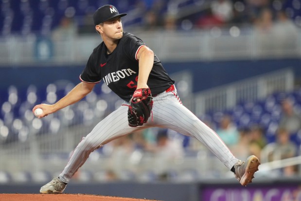 Minnesota Twins starting pitcher David Festa throws during the first inning of a baseball game against the Miami Marlins, Thursday, July 3, 2025, in Miami. (AP Photo/Lynne Sladky)