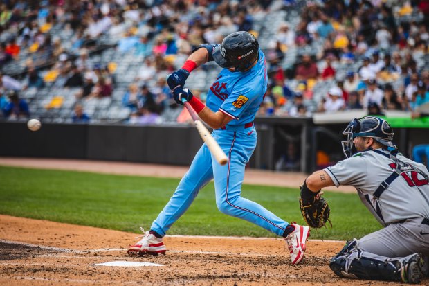 Second baseman Edouard Julien takes a swing during a St. Paul Saints game this season at CHS Field. He broke camp with the Twins but was sent back to St. Paul after 29 games. Hitting .395 with three home runs in his past 11 games, Julien is hoping to convince the Twins he's ready for another chance. (Rob Thompson / St. Paul Saints)