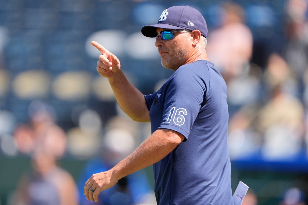 Tampa Bay Rays manager Kevin Cash signaling to the bullpen.