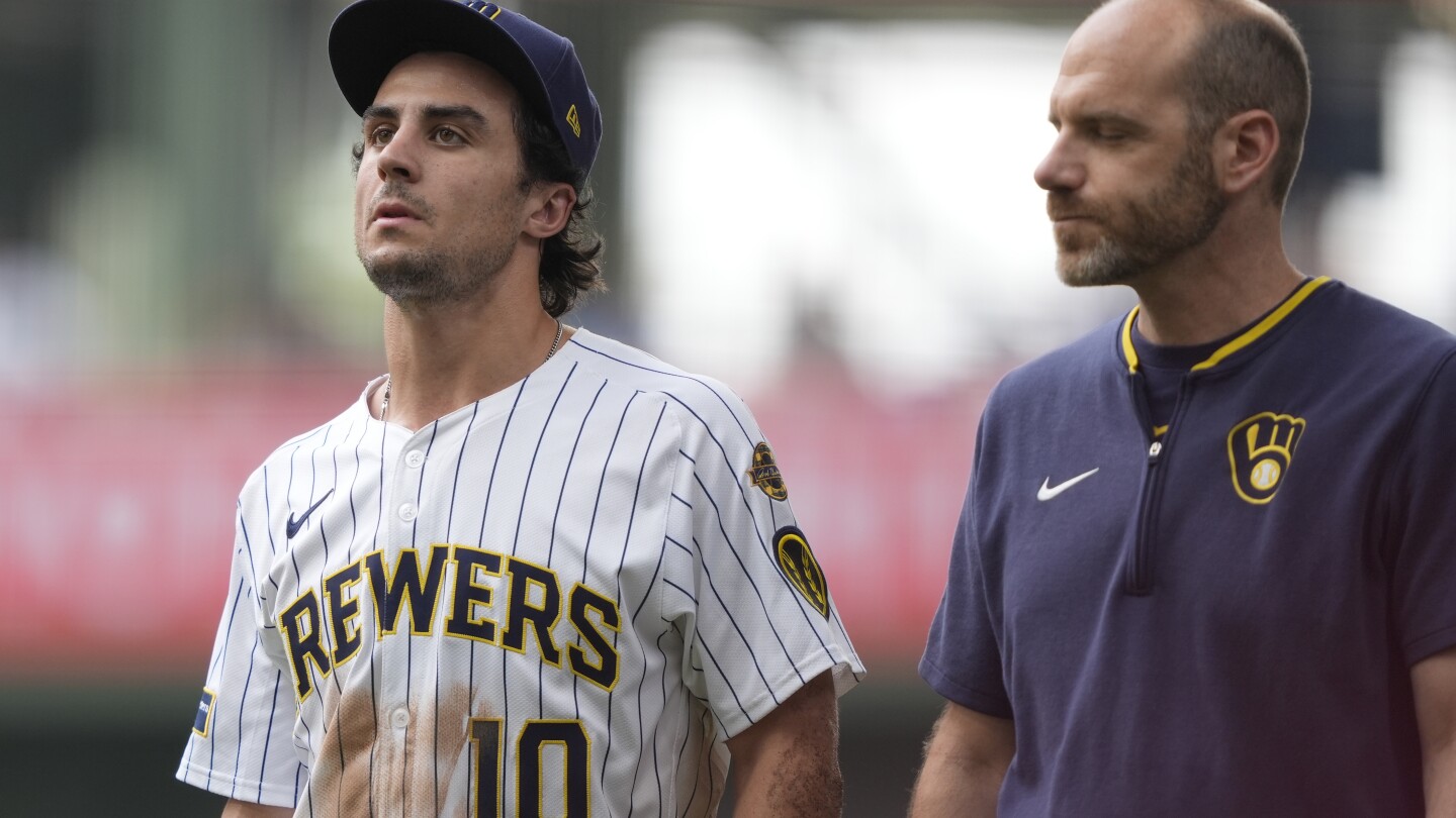 Brewers RF Sal Frelick departs after making a sliding grab