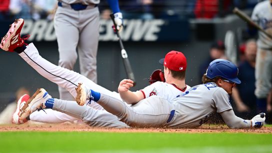 Los Angeles Dodgers first baseman Kike Hernandez (8) scores on a wild pitch as Cleveland Guardians relief pitcher Tim Herrin (29) defends the plate during the seventh inning at Progressive Field. Los Angeles Dodgers first baseman Kike Hernandez (8) scores on a wild pitch as Cleveland Guardians relief pitcher Tim Herrin (29) defends the plate during the seventh inning at Progressive Field.
