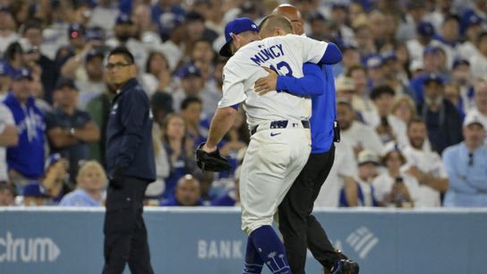 Los Angeles Dodgers third baseman Max Muncy (13) is helped off the field after he was injured on a play during the fifth inning against the Chicago White Sox at Dodger Stadium. Los Angeles Dodgers third baseman Max Muncy (13) is helped off the field after he was injured on a play during the fifth inning against the Chicago White Sox at Dodger Stadium.