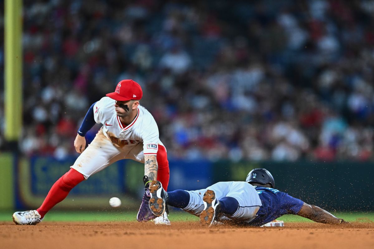Seattle Mariners outfielder Randy Arozarena (56) steals second base against Los Angeles Angels shortstop Zach Neto (9) during the sixth inning at Angel Stadium. Seattle Mariners outfielder Randy Arozarena (56) steals second base against Los Angeles Angels shortstop Zach Neto (9) during the sixth inning at Angel Stadium.