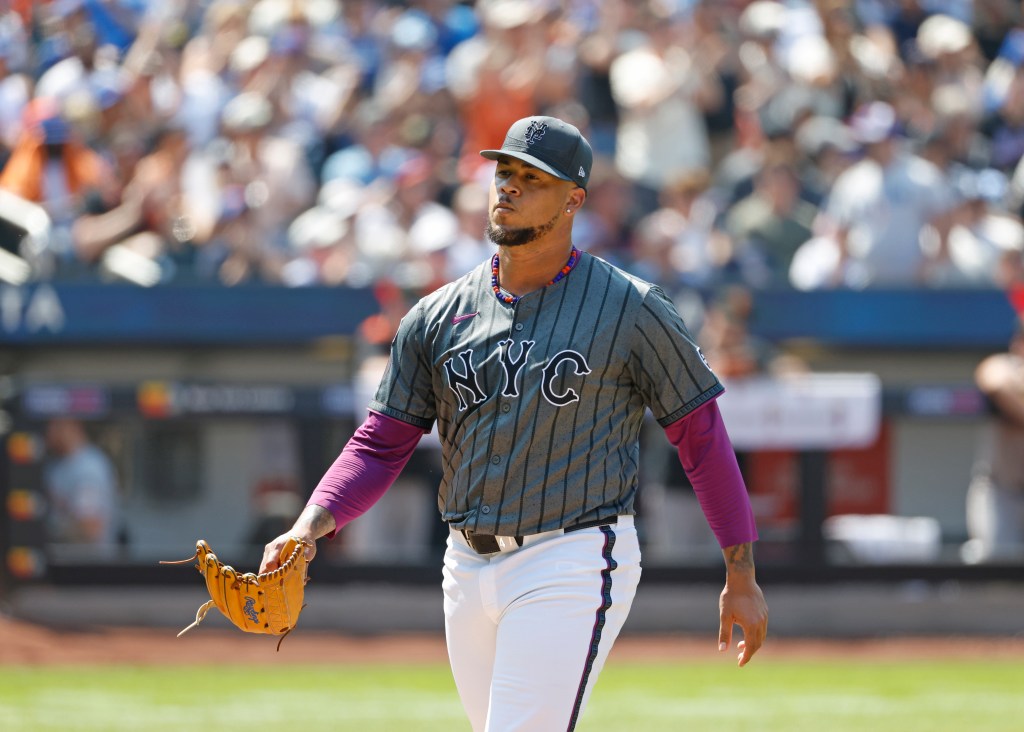 Frankie Montas #47 of the New York Mets walking off the field.