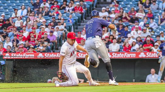 Yusei Kikuchi #16 of the Los Angeles Angels tries to tag Yandi Diaz #2 against the Tampa Bay Rays at Angel Stadium of Anaheim on August 4, 2025 in Anaheim, California.