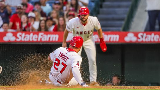 Mike Trout #27 of the Los Angeles Angels slides home against the Tampa Bay Rays at Angel Stadium of Anaheim on August 4, 2025 in Anaheim, California.