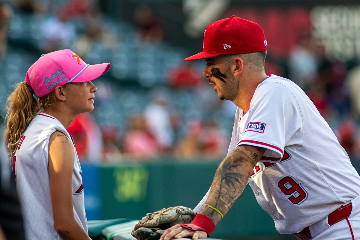 Los Angeles Infielder Zach Neto speaks to his daughter before playing in an MLB game against the Cincinnati Reds, Wednesday, August 20, 2025 at Angels Stadium in Anaheim, California.