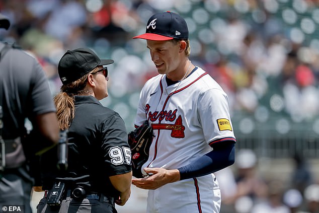 Hurston Waldrep is checked for foreign materials by Pawol before heading to the mound