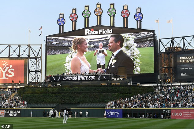 Two lifelong Chicago White Sox fans exchange wedding vows during a 60-second wedding officiated by former White Sox player and 1983 rookie of the year Ron Kittle