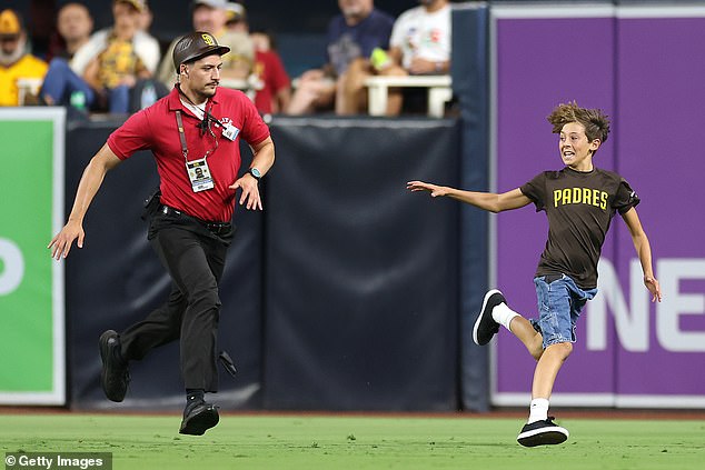 The child initially ran around in a circle before security quickly closed in on the young man