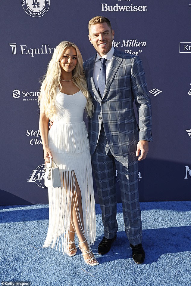 The 35-year-old Freeman, a two-time World Series winner, pictured alongside wife Chelsea