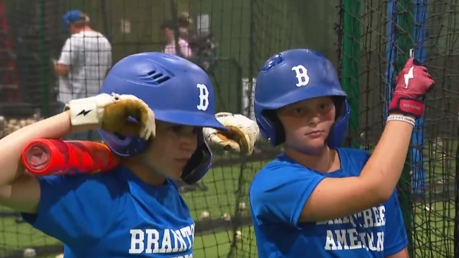 Braintree baseball team practicing swings before playing in Little League Regionals