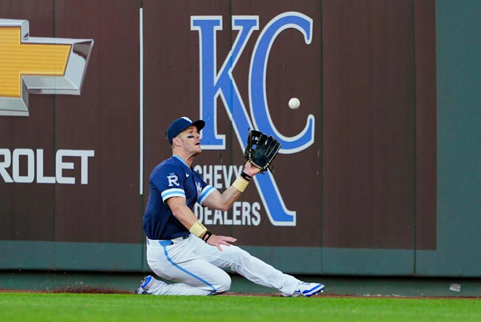 Royals outfielder Mark Canha makes a sliding catch during the third inning of a Friday, May 9, 2025 Major League Baseball game against the Boston Red Sox at Kauffman Stadium in Kansas City.