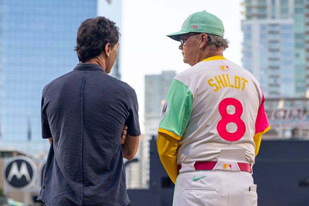 San Diego Padres President of baseball operations A.J. Preller and Mike Shildt #8 chat before the game against the St. Louis Cardinals at Petco Park on Friday, Aug. 1, 2025 in San Diego, CA. (Meg McLaughlin / The San Diego Union-Tribune)
