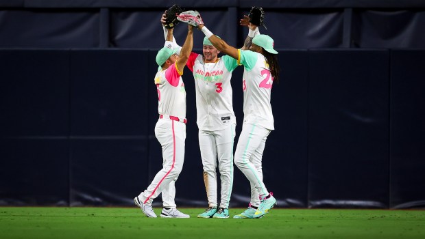 Ramon Laureano, left, participates in his first postgame celebration with Jackson Merrill, center, and Fernando Tatis Jr. after the Padres' victory over the Cardinals on Friday. (Meg McLaughlin / The San Diego Union-Tribune)