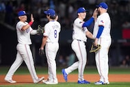 Texas Rangers first baseman Rowdy Tellez (right) celebrates with outfielder Wyatt Langford...