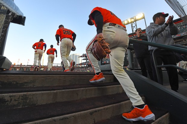 San Francisco Giants players take the field before the start of their MLB game at Oracle Park in San Francisco, Calif., on Friday, Aug. 8, 2025. The San Francisco Giants defeated the Washington Nationals 5-0. (Jose Carlos Fajardo/Bay Area News Group)