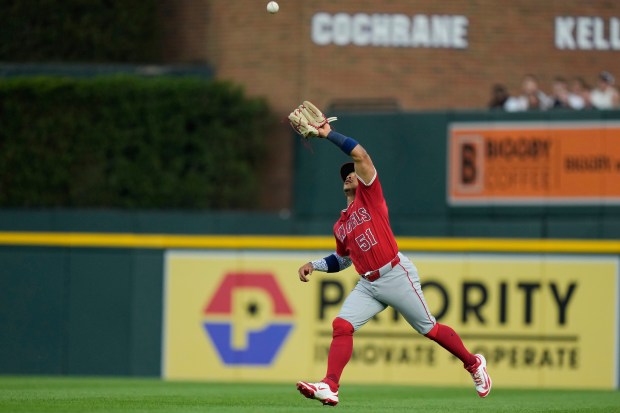 Angels right fielder Gustavo Campero catches a flyout hit by...