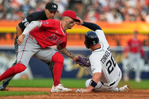 Detroit Tigers’ Spencer Torkelson, right, is tagged out at second...