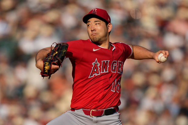 Angels starting pitcher Yusei Kikuchi throws during the first inning...