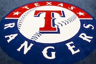 The team logo fills the center of the room in the clubhouse of the Texas Rangers newly...