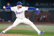 Texas Rangers pitcher Nathan Eovaldi delivers during the eighth inning of a baseball game...