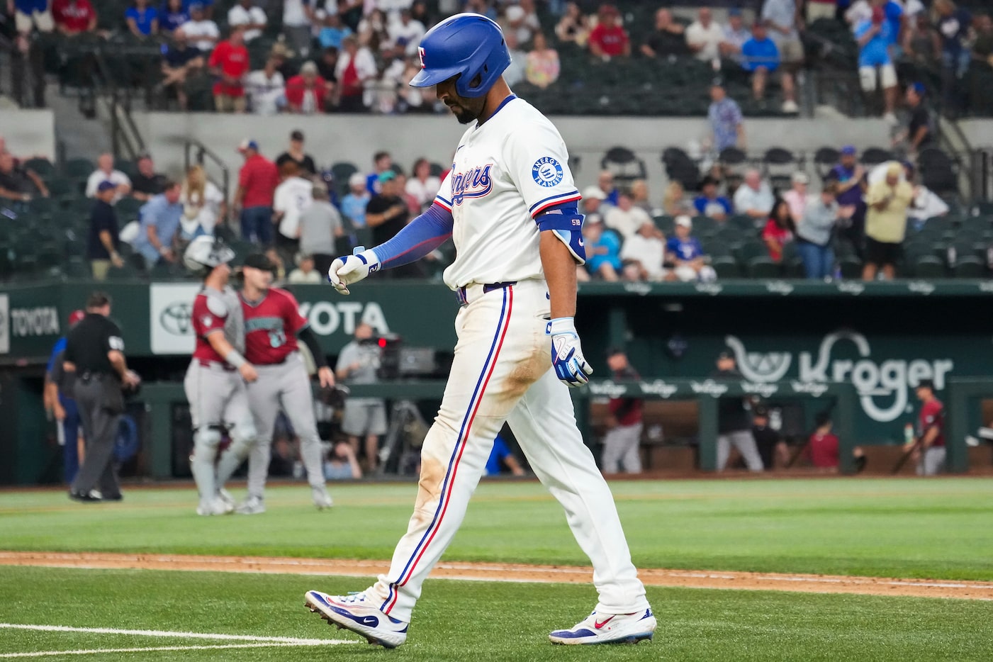 Texas Rangers second baseman Marcus Semien heads to the dugout after lining out for the...