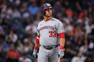 Washington Nationals' Nathaniel Lowe walks to the dugout after striking out during the...