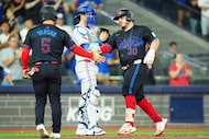 Toronto Blue Jays' Alejandro Kirk, right, celebrates his two-run home run against the Texas...