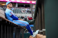 Texas Rangers third baseman Cody Freeman looks out from the dugout before a baseball game...